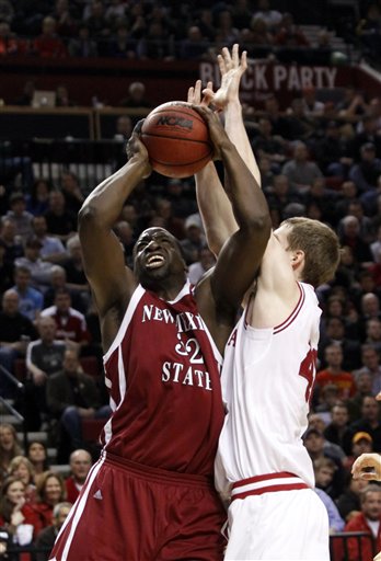 New Mexico State center Hamidu Rahman, left, shoots against Indiana forward Cody Zeller during the first half of their NCAA tournament second-round college basketball game in Portland, Ore., Thursday, March 15, 2012.(AP Photo/Don Ryan)